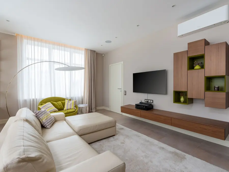 Wall-mounted ductless mini-split head unit in a modern living room
